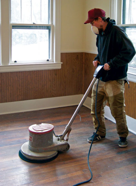 Floor recoating process with a polisher machine for hardwood floors.